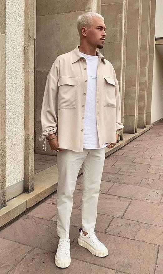 Style reference: a cream overshirt layered over a white T-shirt with light trousers